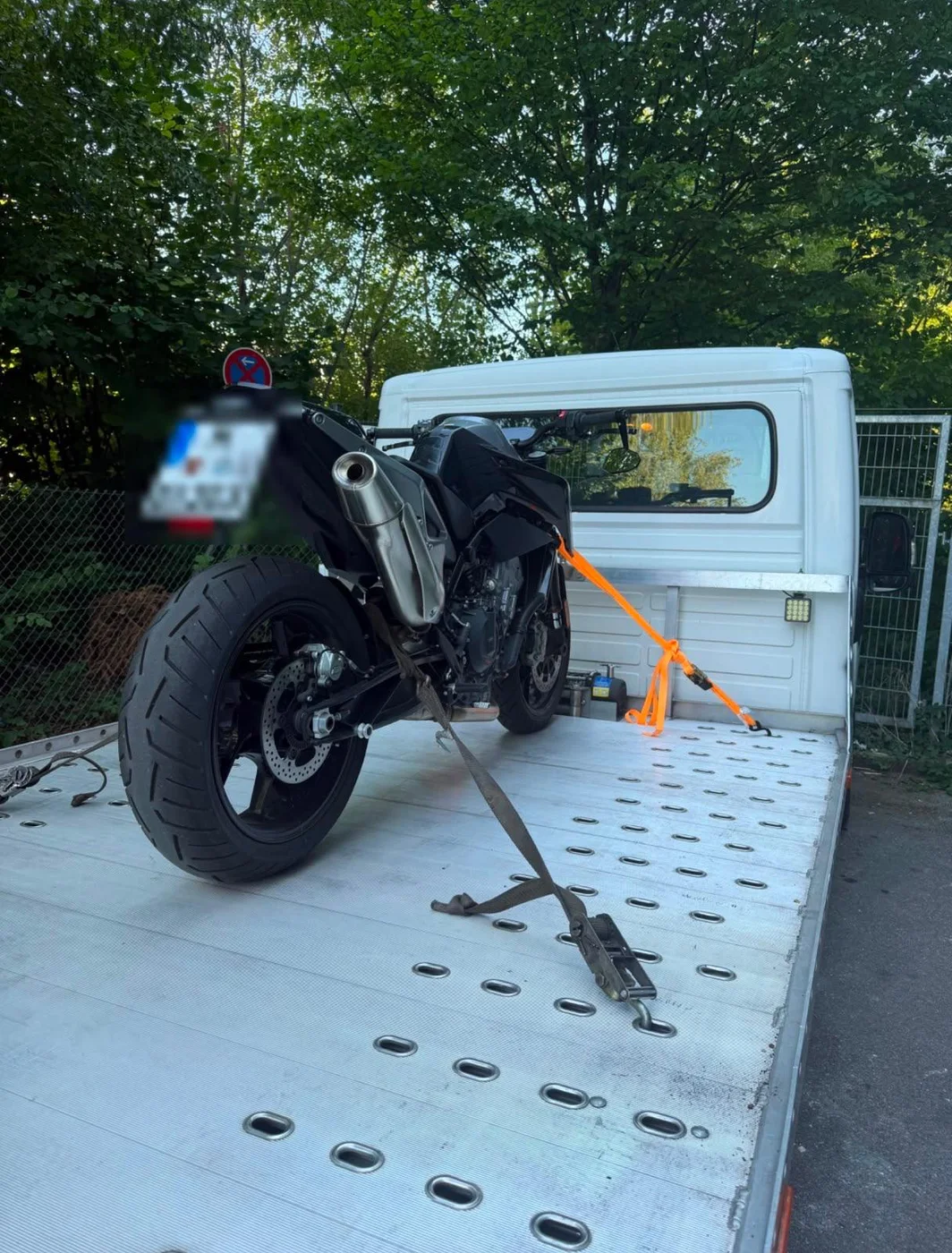Motorcycle secured on the flatbed